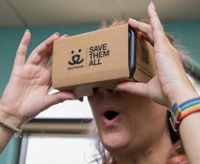 Woman looking through VR headset