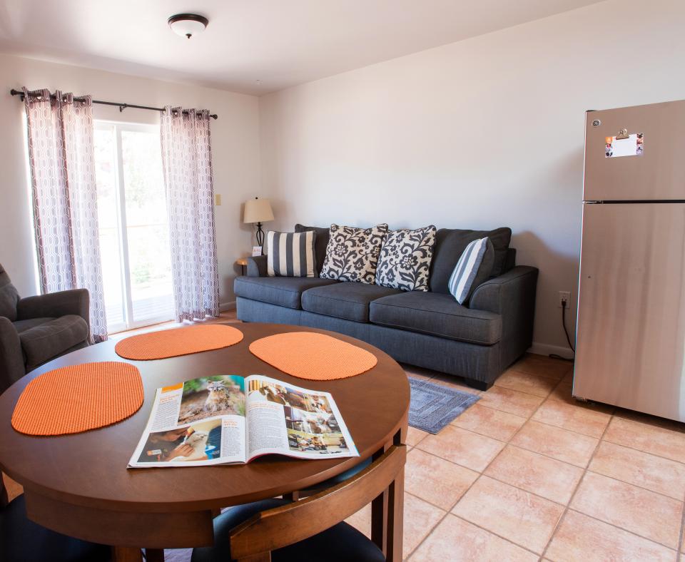 Interior photo of a Best Friends cottage with comfortable seating and a dining area