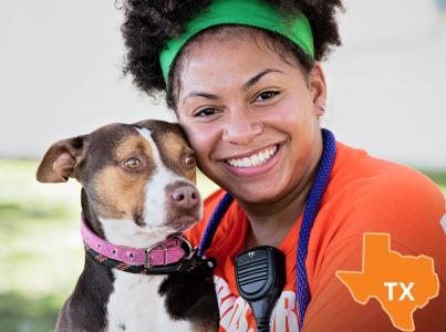 Woman with beagle type dog outdoors