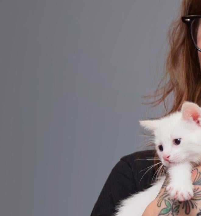 woman holding kittens