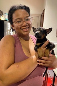 Shelbi Armstrong holding a puppy