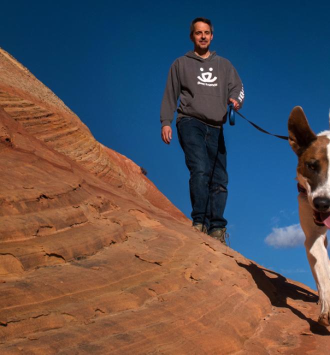 dog hiking with man