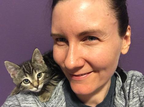 Lizel Allen with a brown tabby kitten on her shoulder