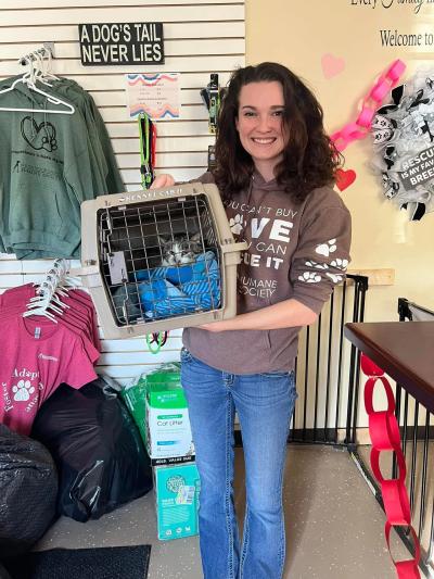 Madison holding Marvin the cat in a carrier